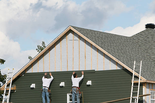 Professional Siding Replacement technician working in Dover, MA